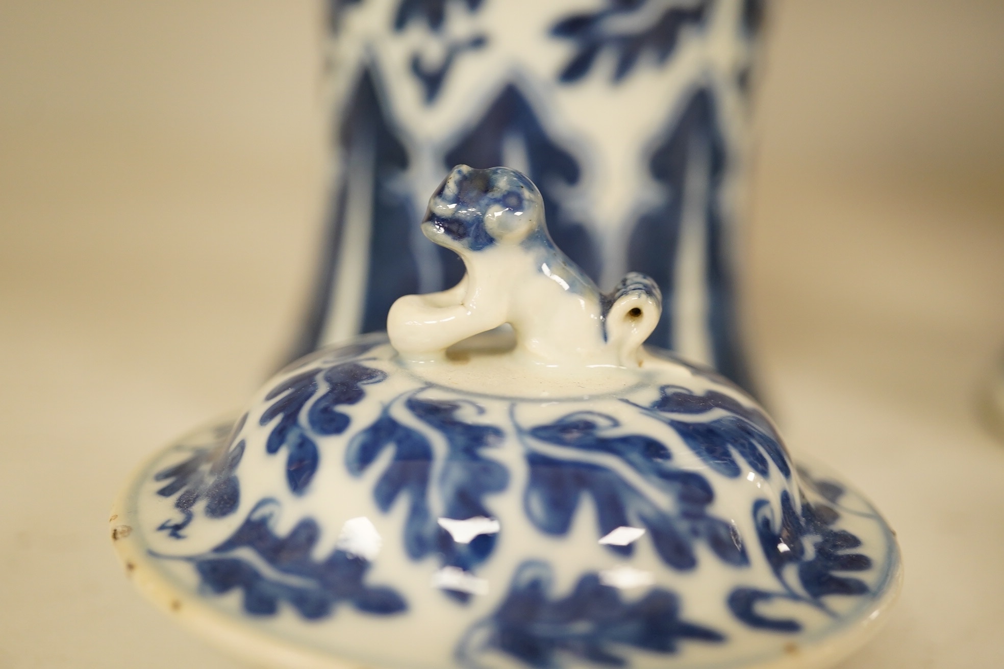 A pair of Chinese blue and white lotus decorated baluster vases and covers, late 19th century